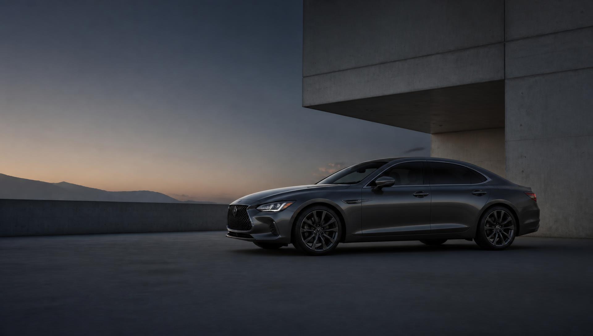 A modern sedan parked beside a concrete structure at dusk
